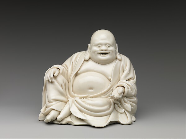 Seventeenth- or eighteenth-century Dehua porcelain figure of the smiling monk Budai with a round belly
