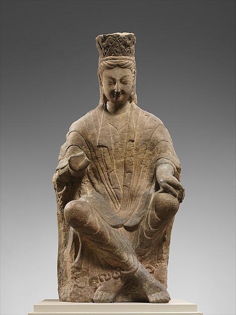 Northern Wei sandstone bodhisattva identified as Maitreya seated with crossed ankles