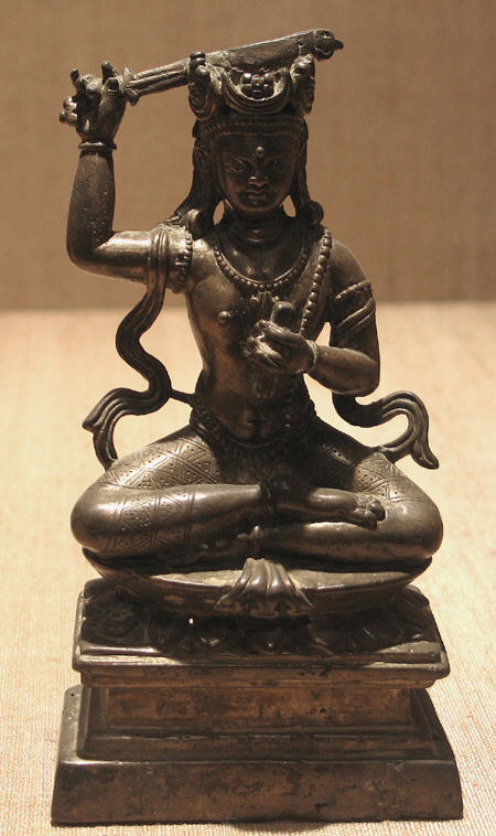 Tenth-century brass Manjushri from Himachal Pradesh holding a sword and manuscript