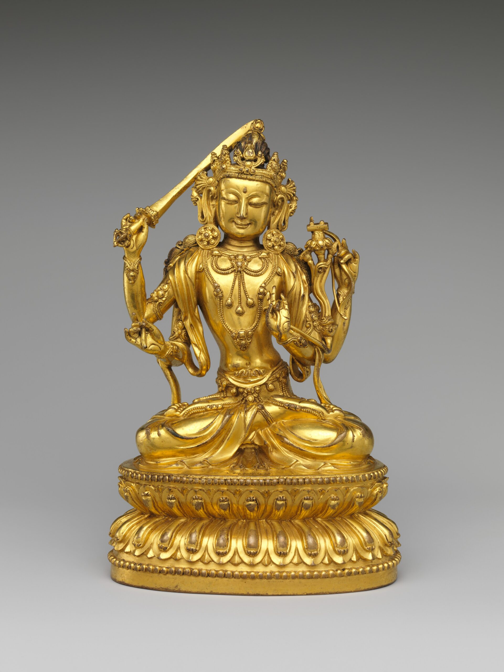 Ming dynasty gilt copper alloy four-armed Manjushri from the Yongle period